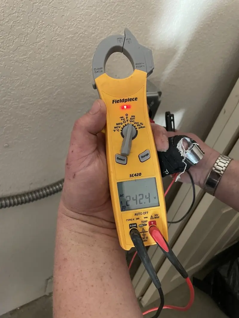 Voltage testing with clamp meter during Outlet Installation in South Jordan